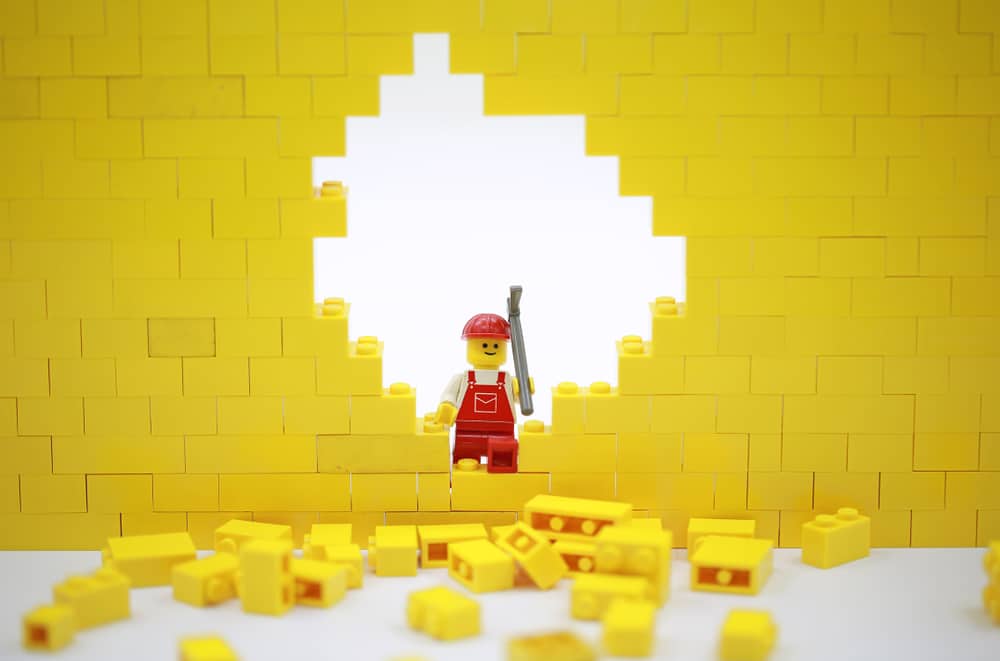 A lego recreation of a scene from a demotion of a building.