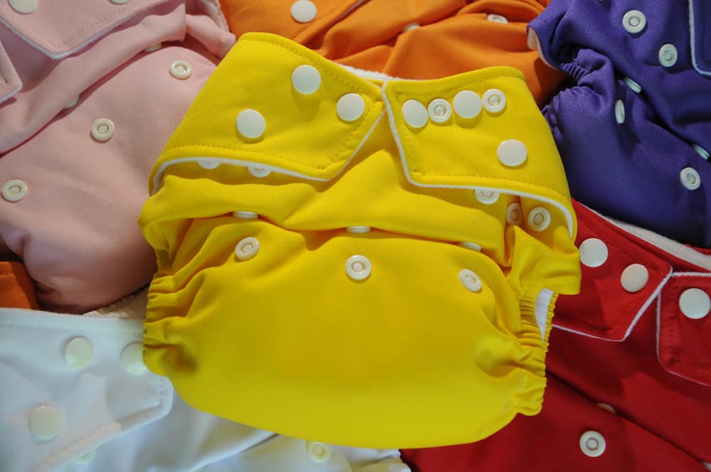 This is a close look at various colorful cloth diapers.