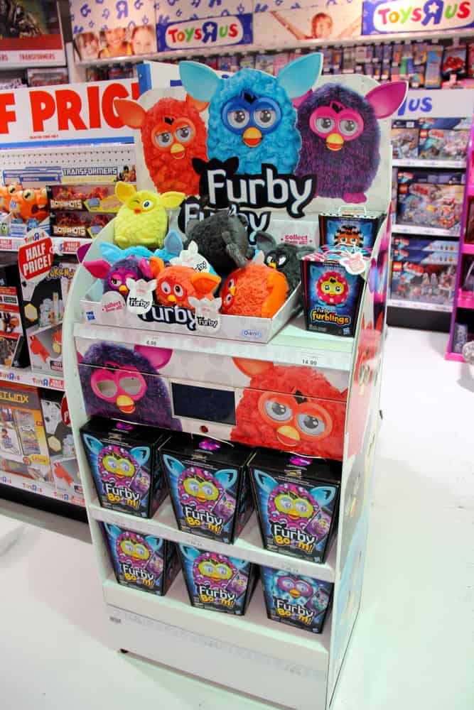 Various Furby toys on display at a toy store.