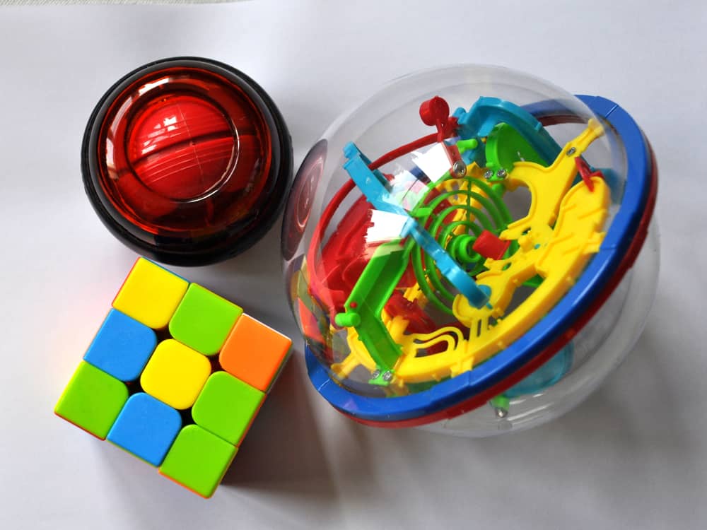 This is a close look at various toys like the Rubik's cube puzzle toy.