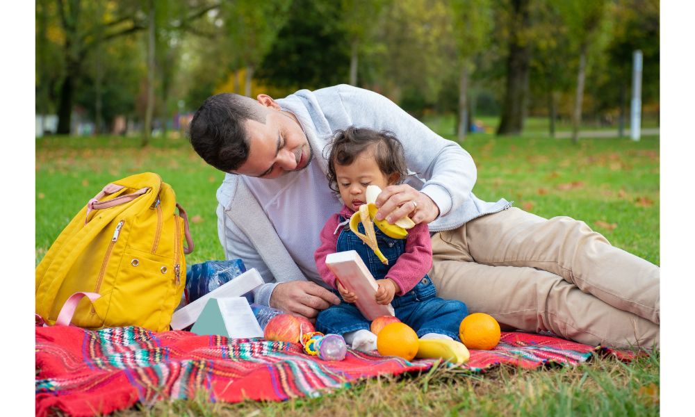 Baby and Dad on a Picnic.