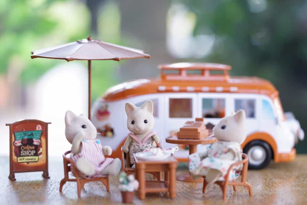 A group of Sylvanian cats chilling and having afternoon tea.