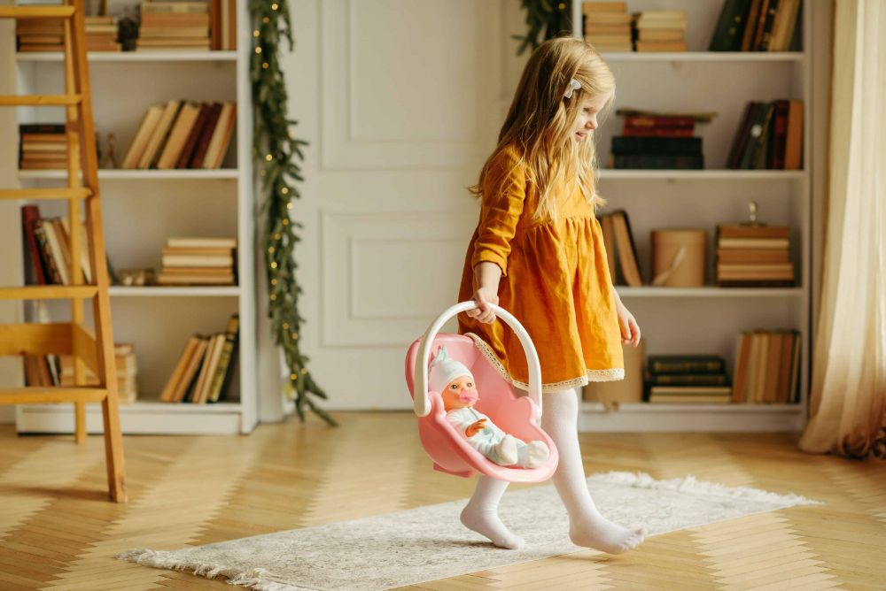 12 Games And Fun Activities For 14 Month Old Baby 2 A Baby Carrying a Toy.