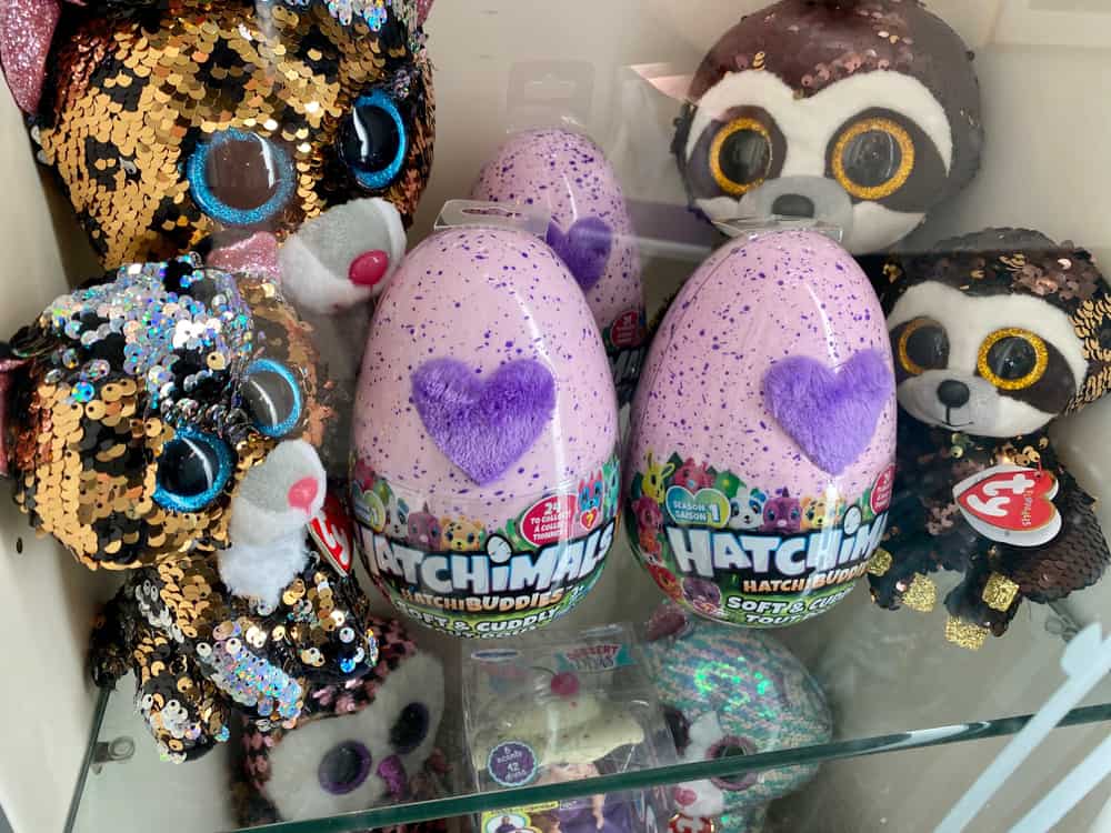 Hatchimals Hatch Buddies eggs on glass shelves.