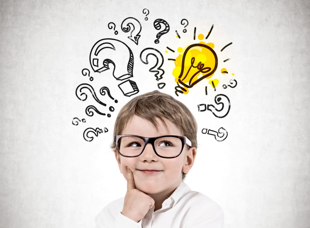 250 Best Would You Rather Questions for Kids 1 A kid with glasses that has ideas and questions in his head. Would you rather questions for kids.
