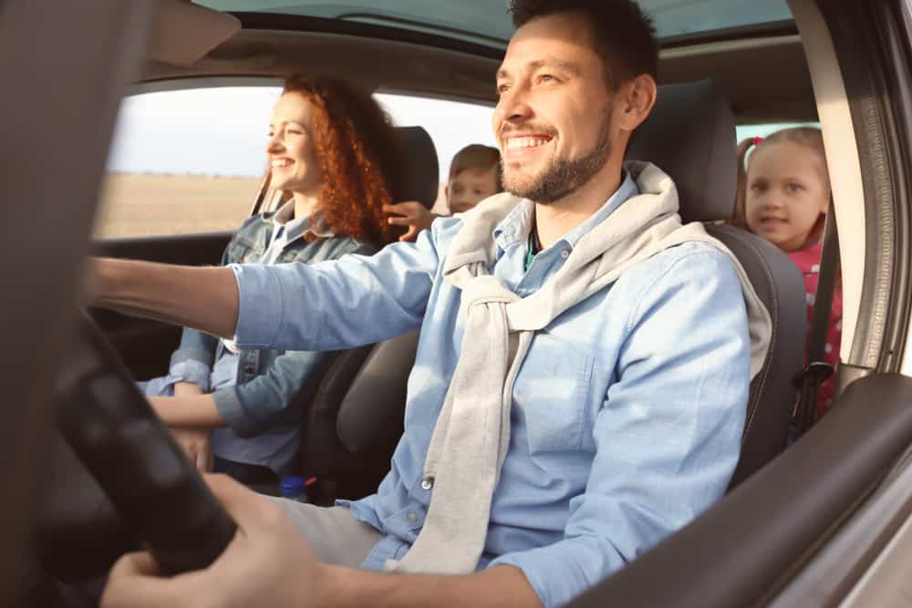 A family on a roadtrip playing the quiet game.
