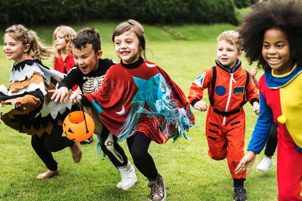 A group of kids wearing costumes.