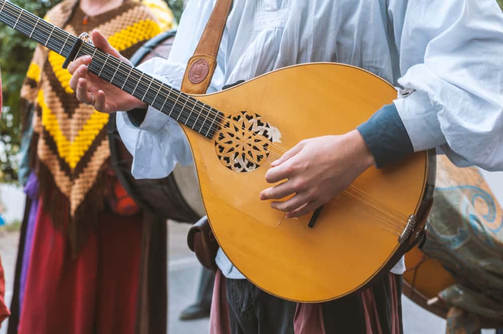 This is a close look at a man playing the mandolin.