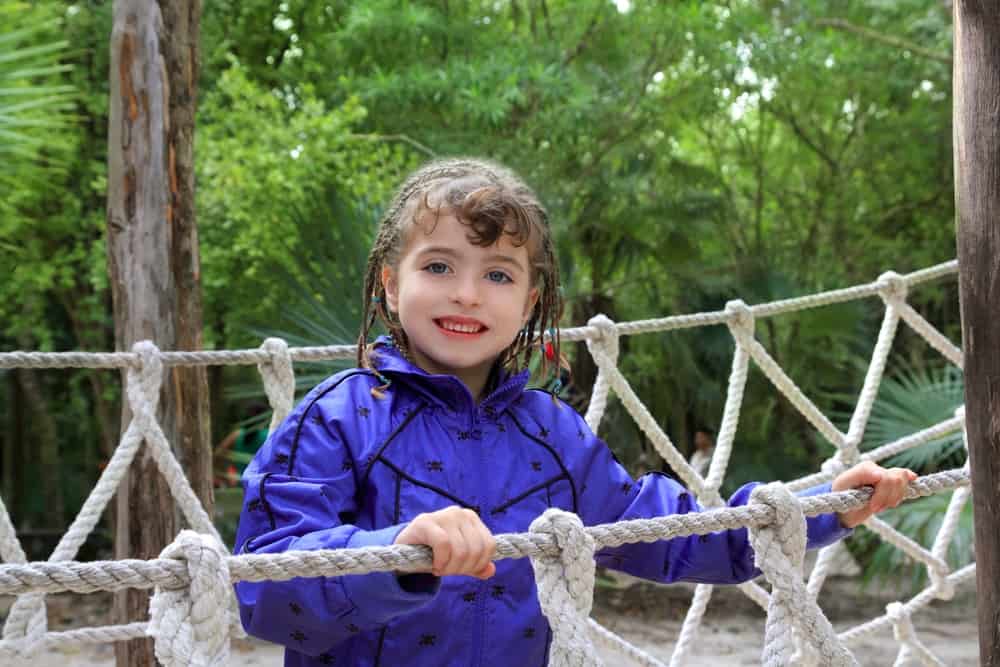 A girl on a rope bridge.