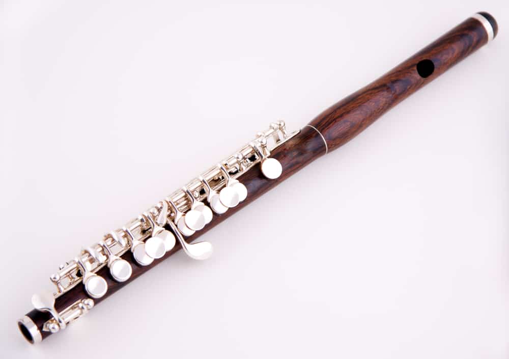 This is a close look at a wooden piccolo flute.