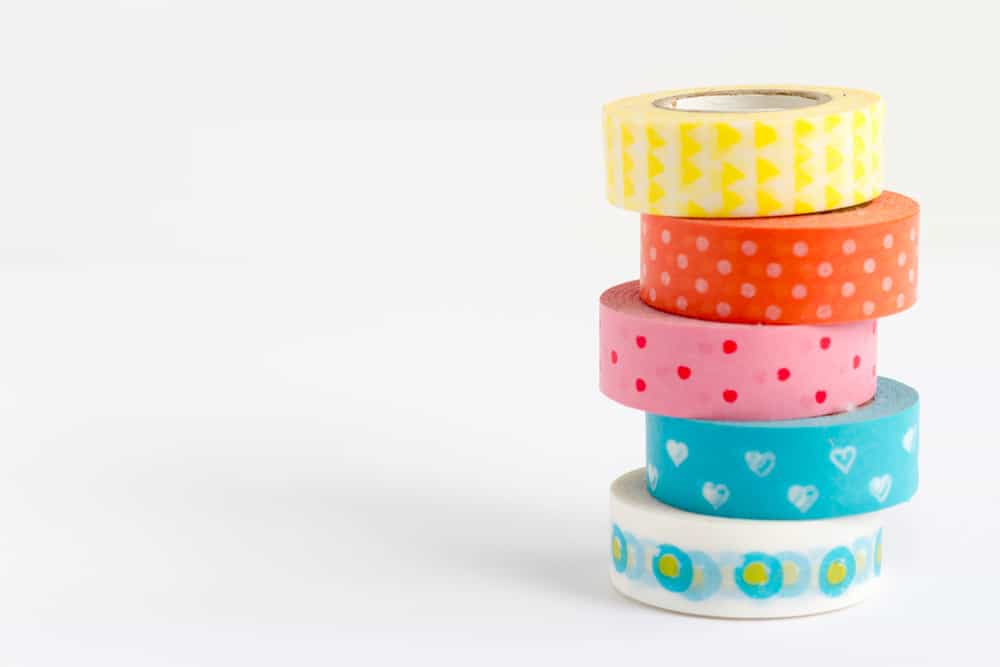 A stack of colorful patterned tapes.