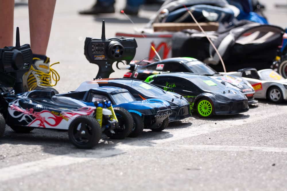 A close look at a row of remote-controlled toy cars.