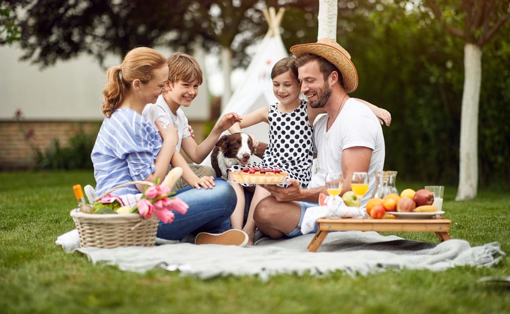 A happy family on a backyard picnic.