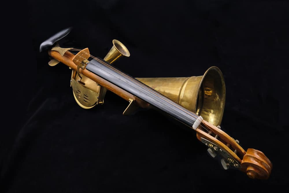 8 Popular Types of Violins 3 A close look at a stroh violin on a black surface.