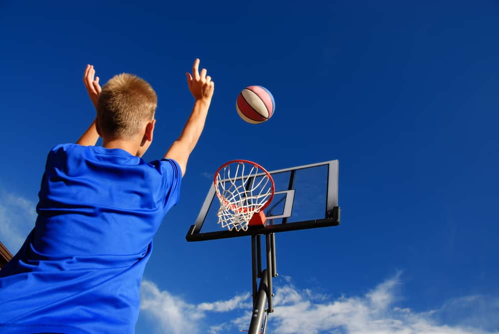 A close look at a boy playing basketball.