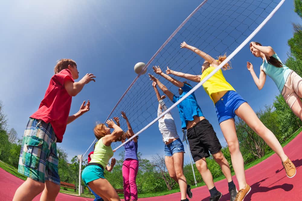 A group of friends playing volleyball.