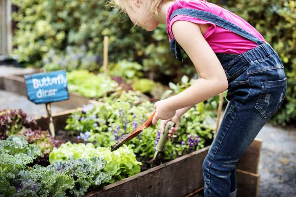 This is a close look at a girl tending the garden.