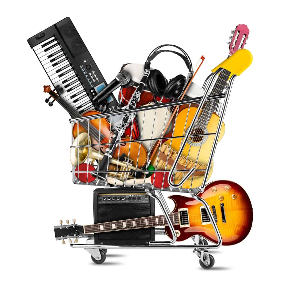A pile of music instruments in a shopping cart.