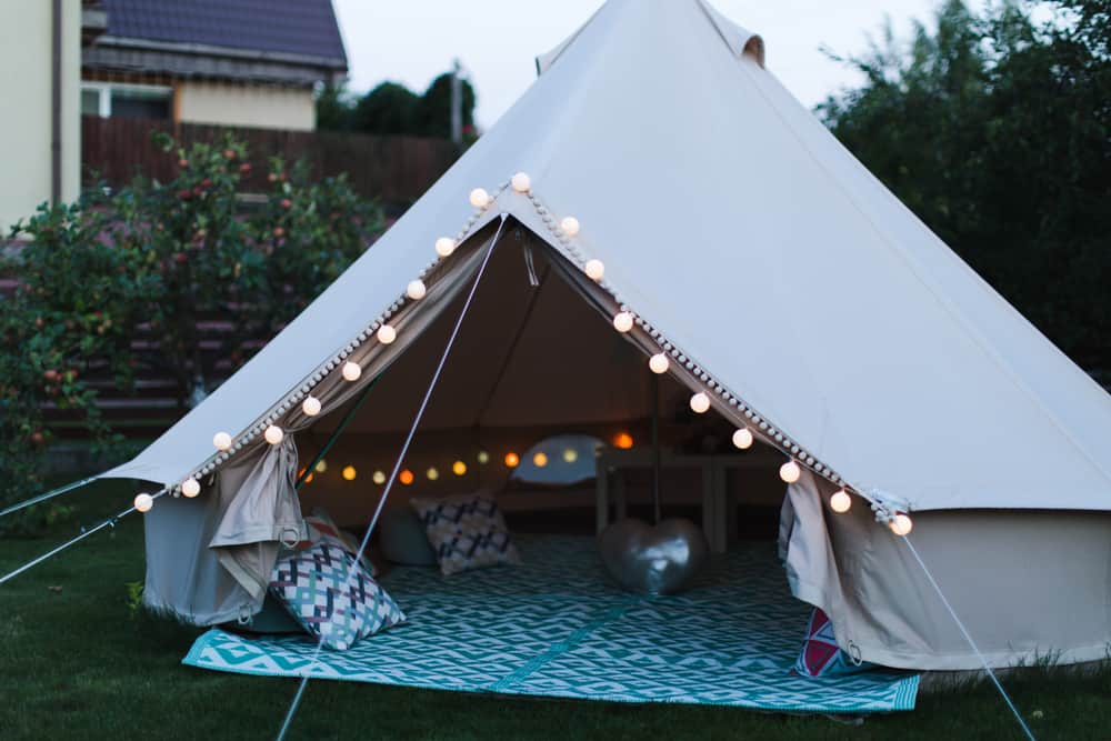A close look at a lighted tent set up in the backyard.