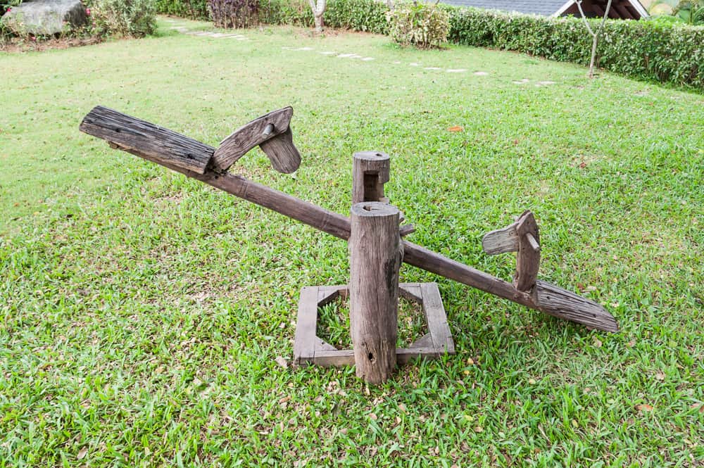 This is a rustic wooden seesaw.