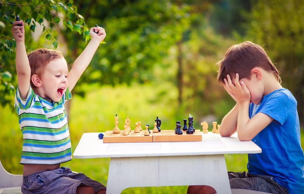 Two boys playing chess.