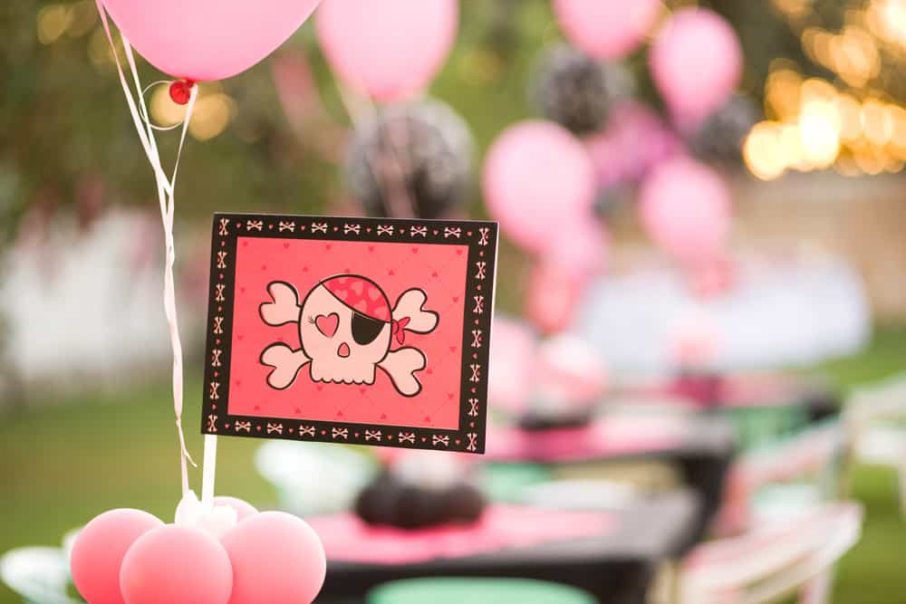 A close look at a pink pirate theme party.