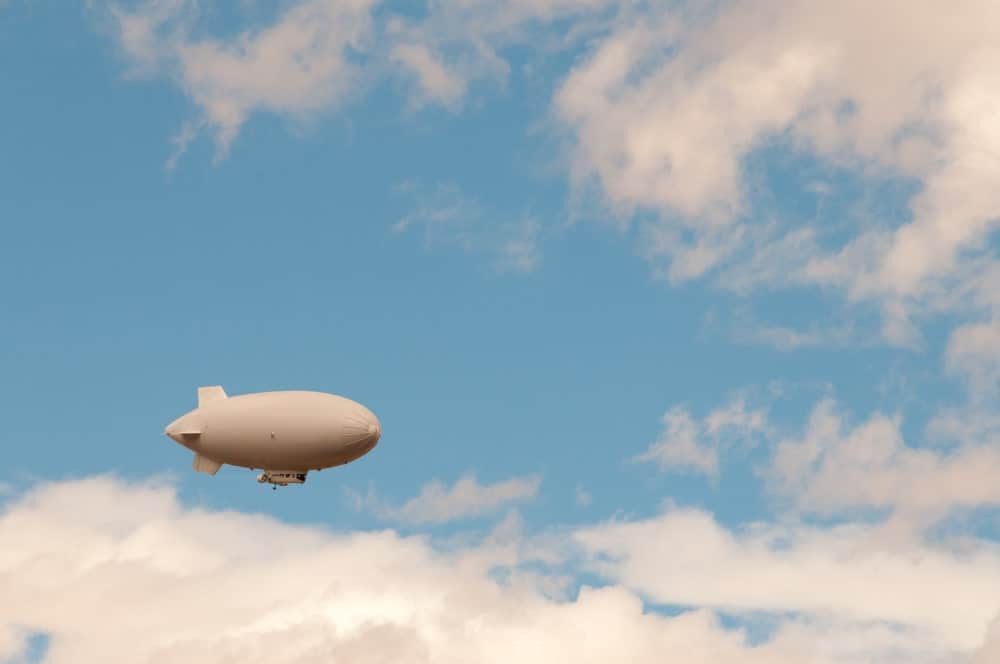 Barrage balloon up in the sky.