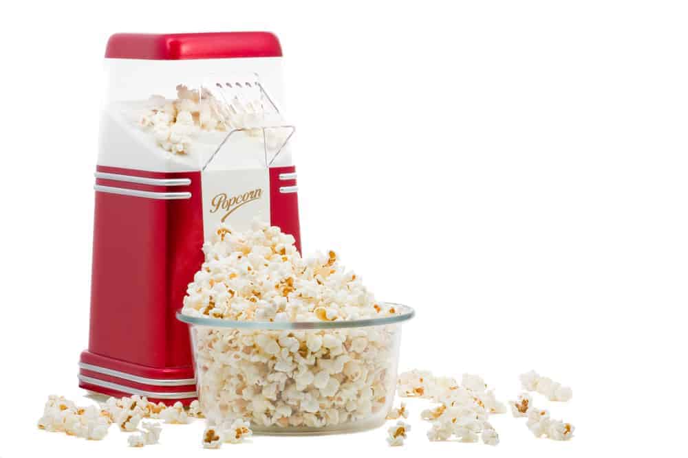 Hot Air Popcorn Maker beside a bowl of popcorn.