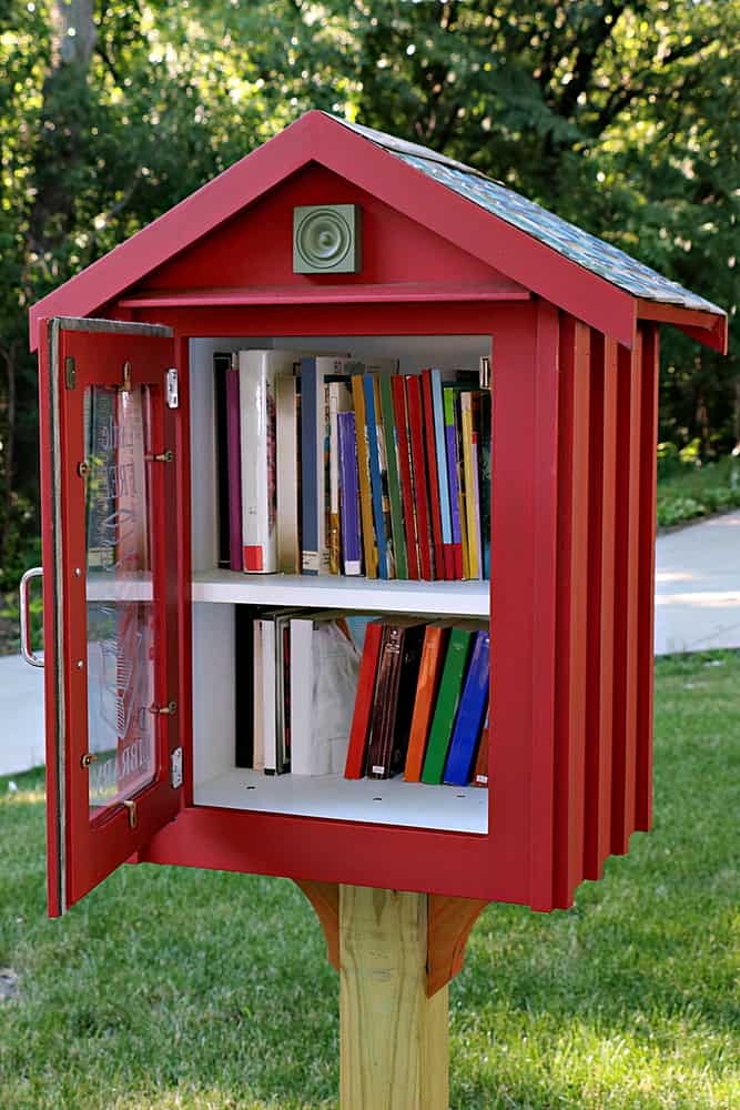 Sidewalk library in residential neighborhood.