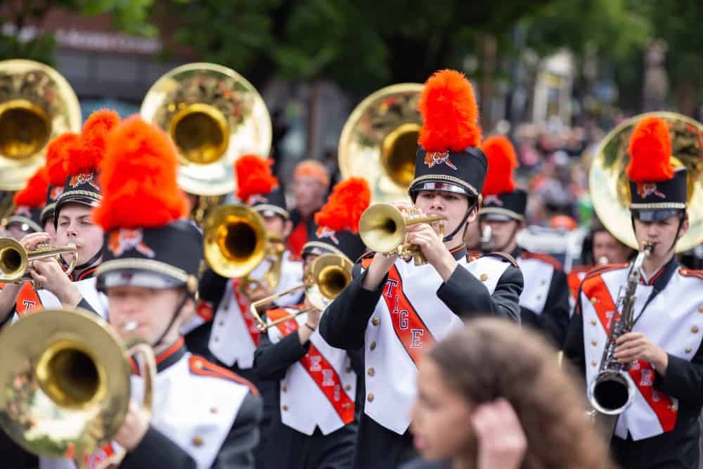 Marching band playing tuba and trumpets.