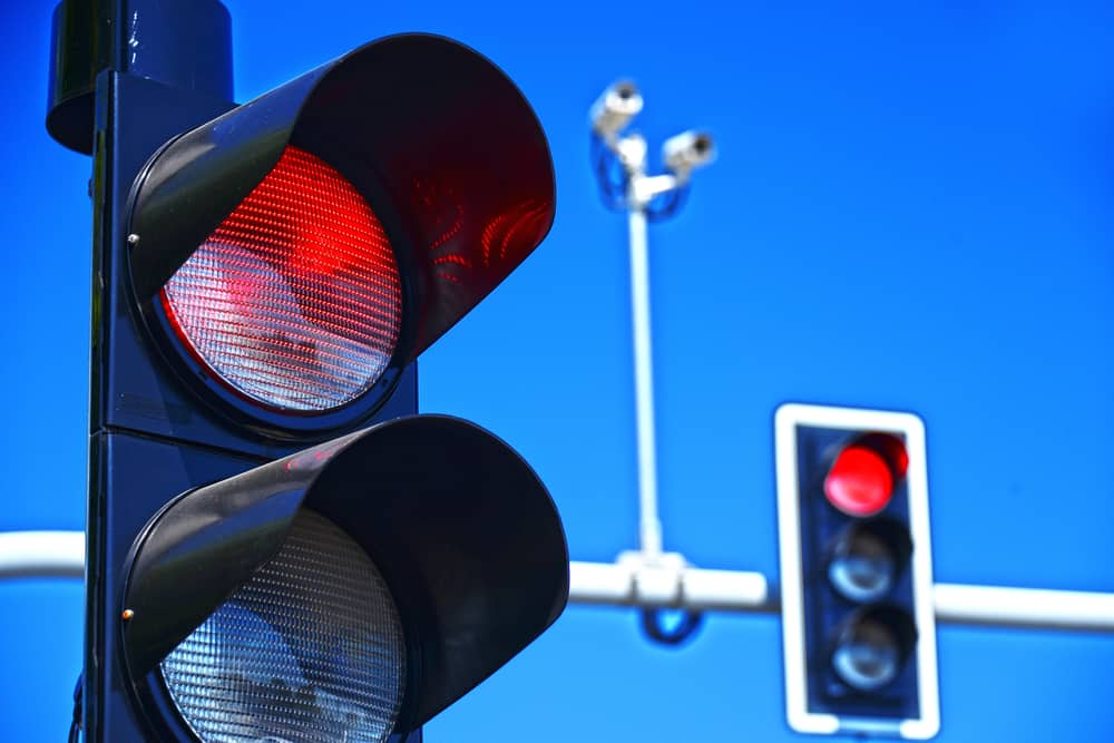 Traffic lights against the clear blue sky.