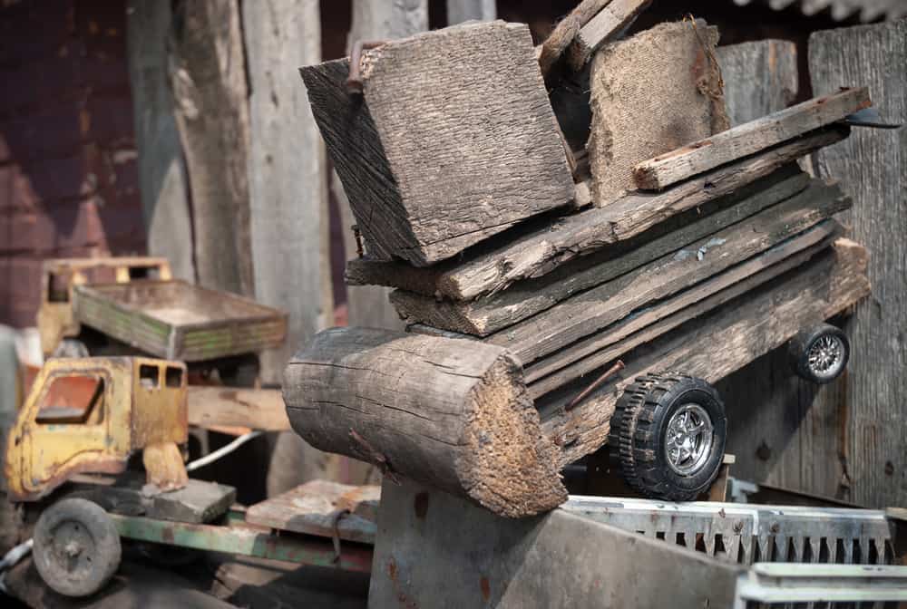 This is a close look at a homemade wooden toy truck.