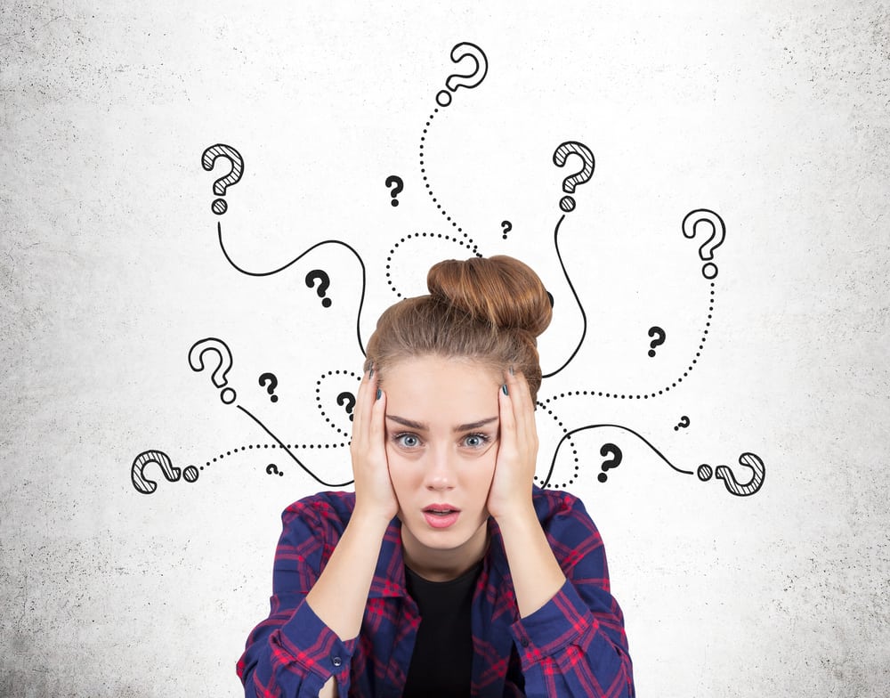 250 Best Would You Rather Questions for Teens 10 This is a close look at a problematic teen girl with question marks above her head.