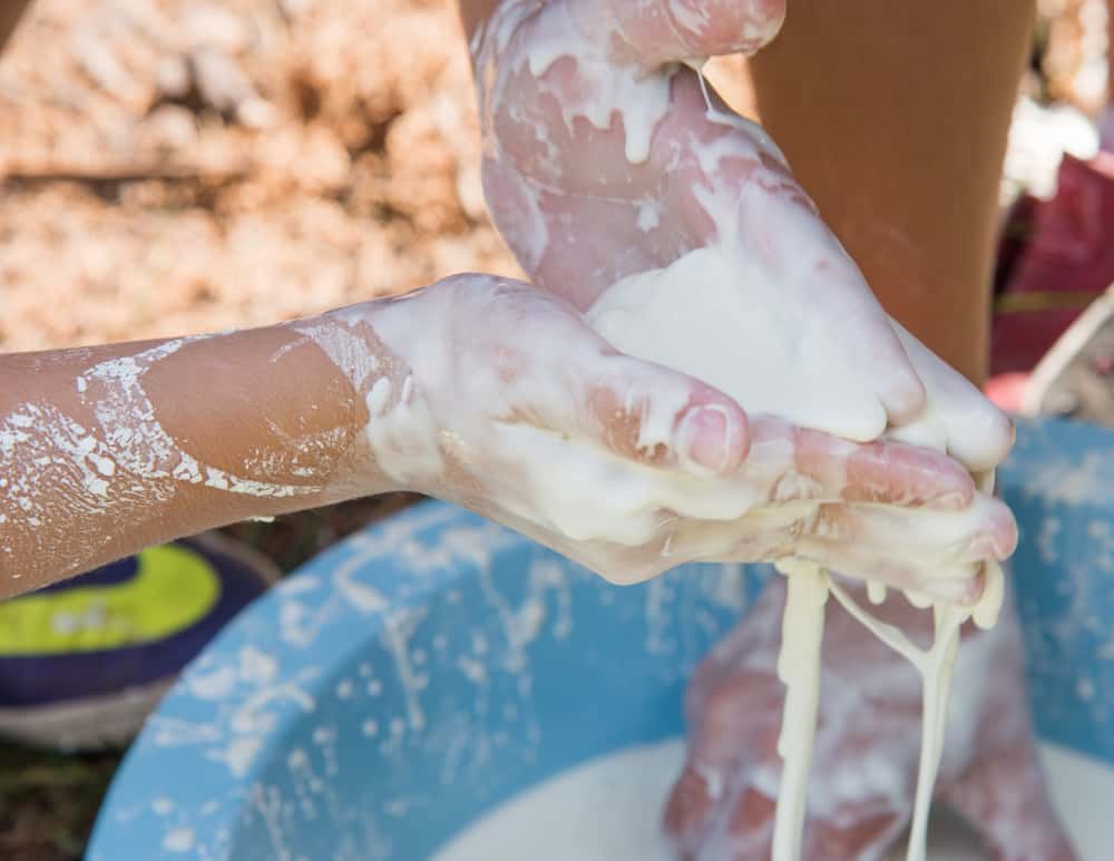 This is a close look at kids playing with oobleck.