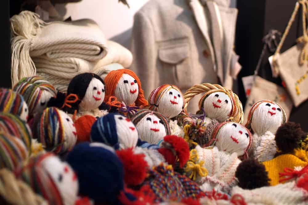 A bunch of weaving dolls placed in the closet.