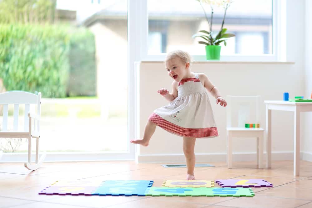 50 Best Music Activities for Kids 3 Little girl dancing at home.