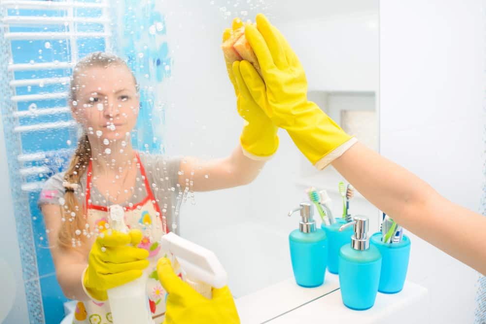 9 Best Chores for 10-12 Year Olds 11 Girl cleaning the bathroom mirror.