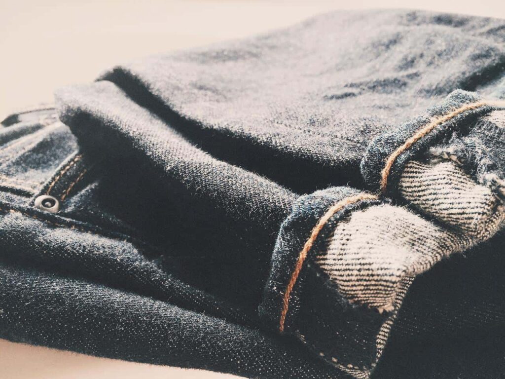 Close-up look at a girl's denim pants.