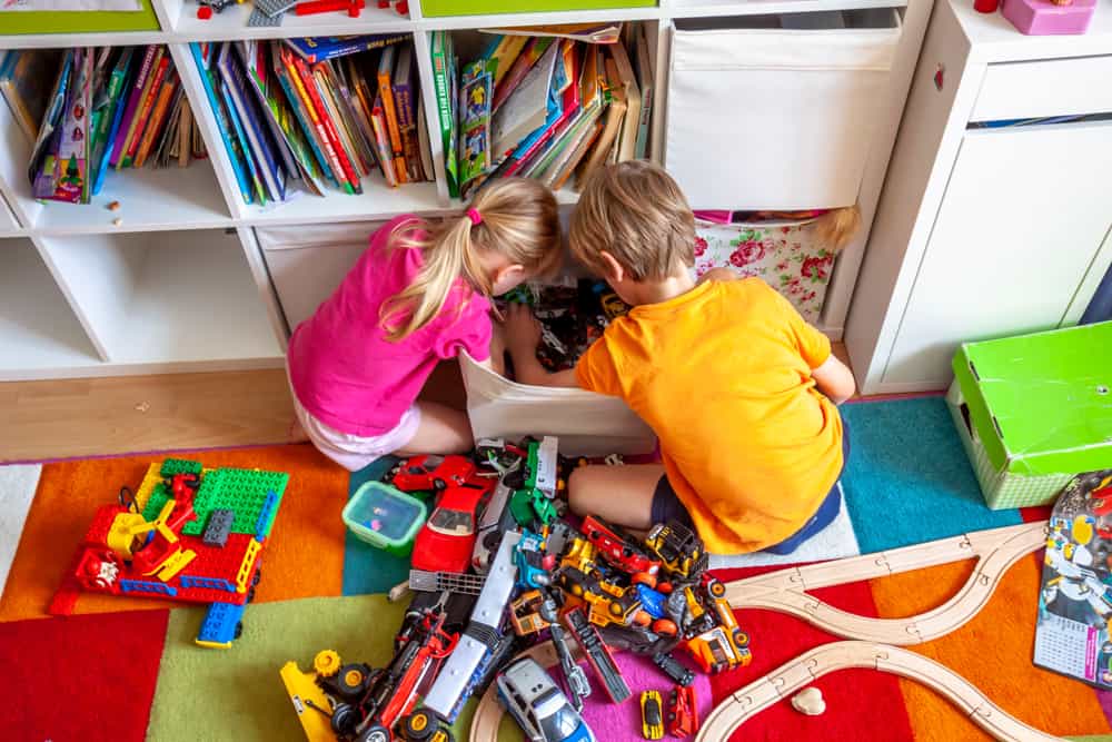 20 Best Chores for 7-9 Year Olds 14 Kids sorting their toys in the storage bin.