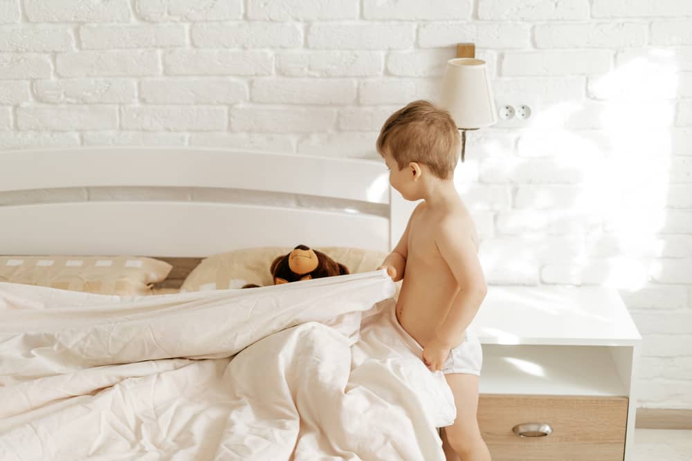 15 Best Chores for 5-6 Year Olds 7 Naked little boy making his bed.