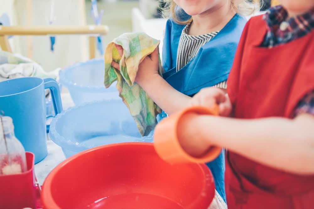 15 Best Chores for 5-6 Year Olds 5 Kids washing plastic dishes.