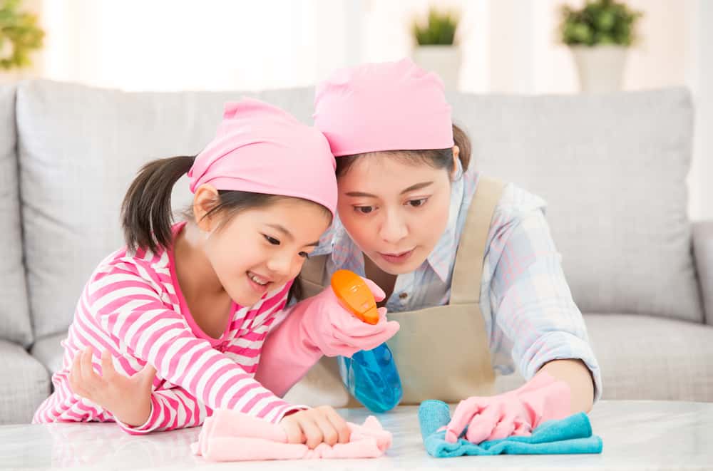 15 Best Chores for 5-6 Year Olds 15 Mother and daughter wiping the coffee table.