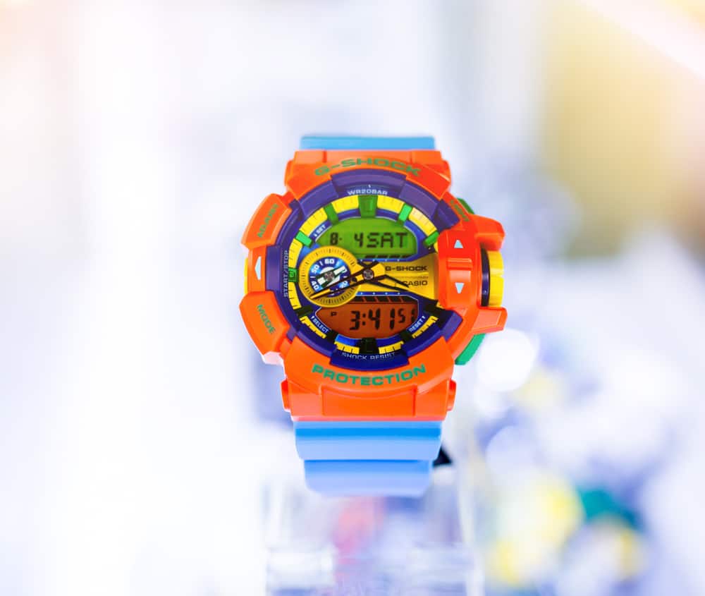 Colorful digital watch for kids with bokeh background.