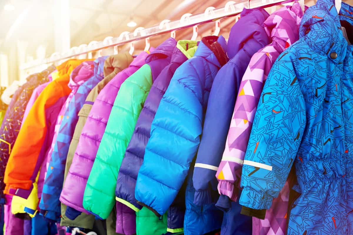 Different kinds of kids jackets on hanger.