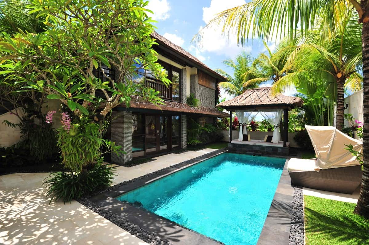 Lap pool with concrete paving.