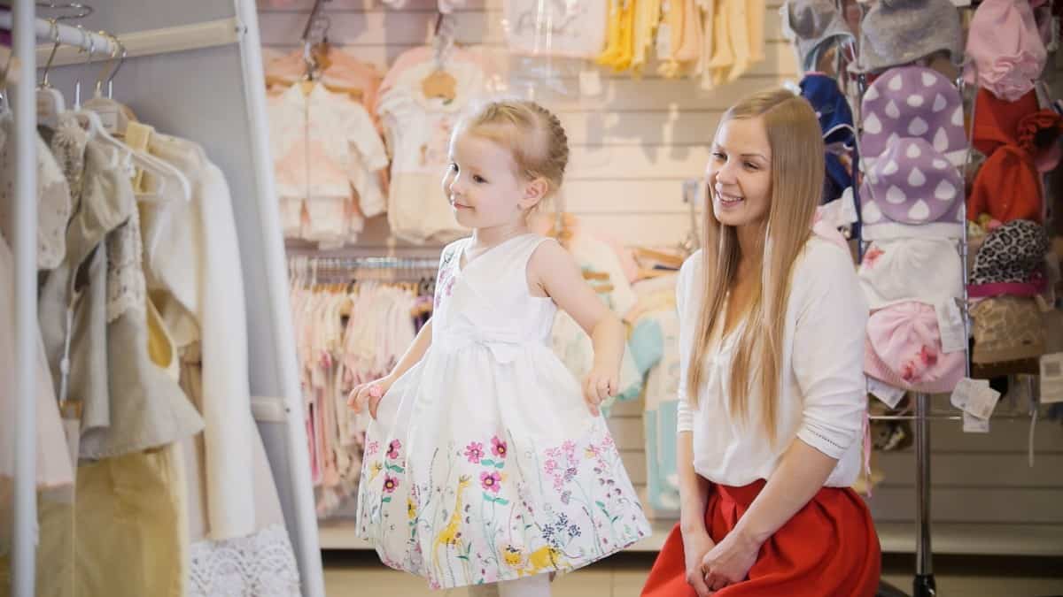 Mom and daughter shopping for clothes.