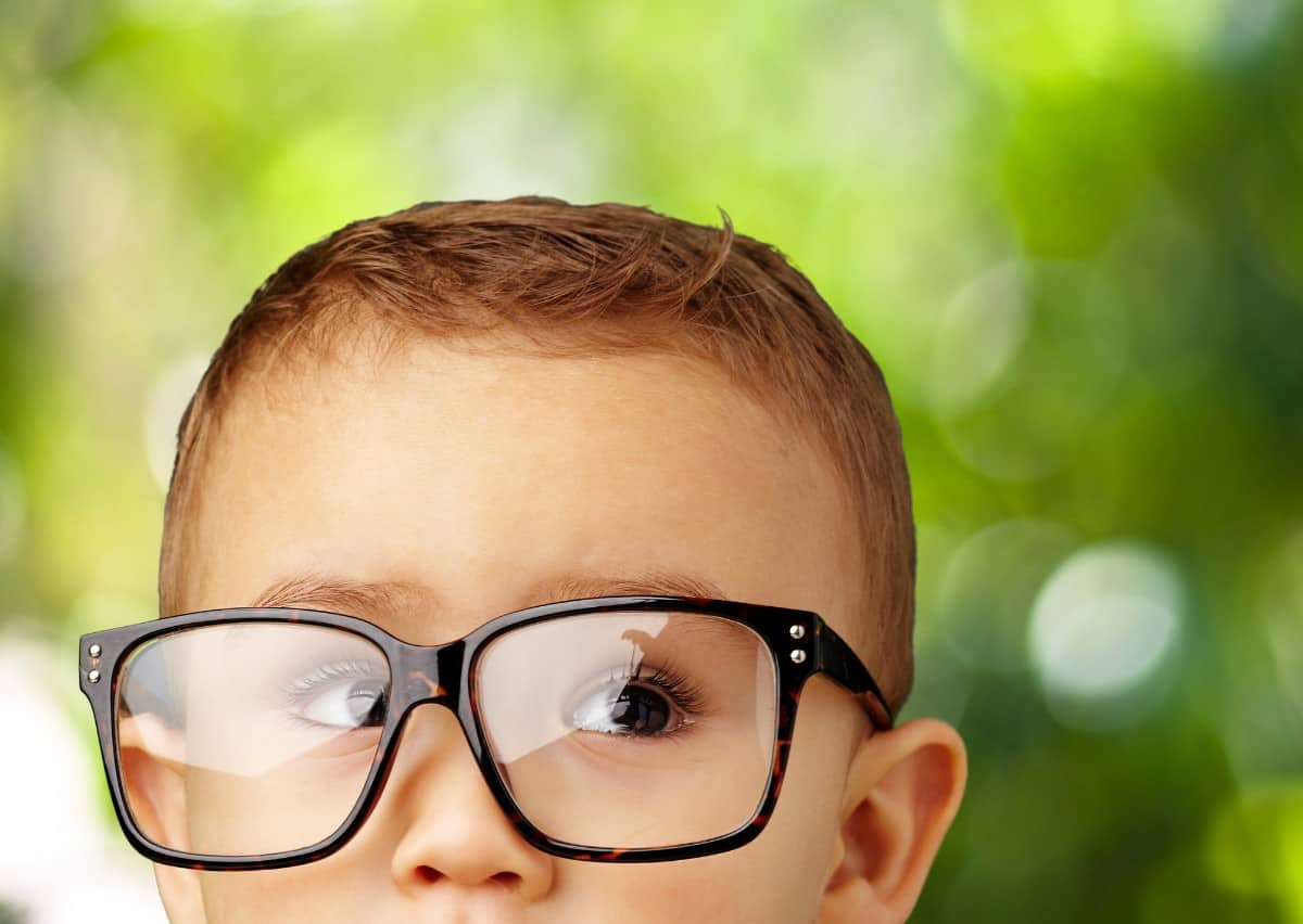 Little kid wearing eyeglasses.