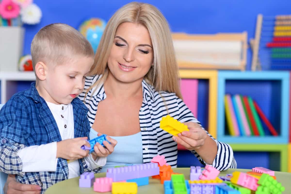 Mom and son playing Lego.