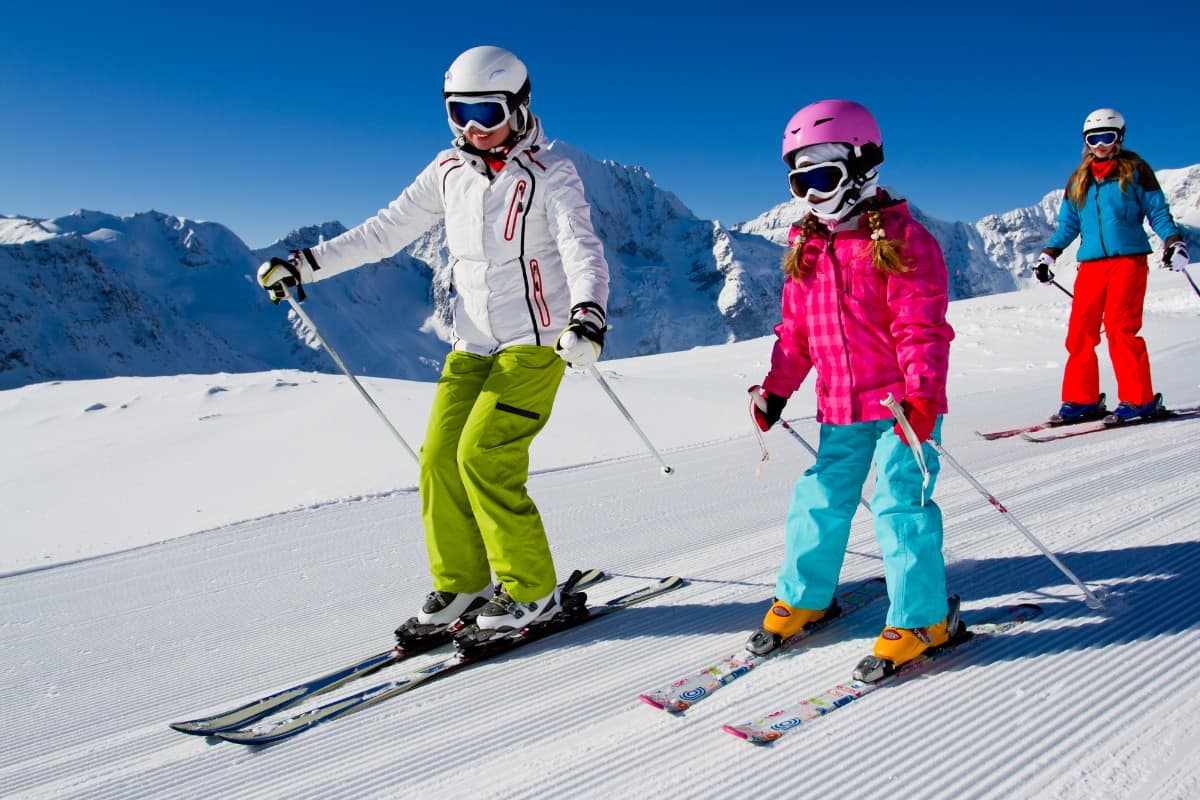 12 Popular Types of Skis for Kids 3 Mom teaching her kid to ski.