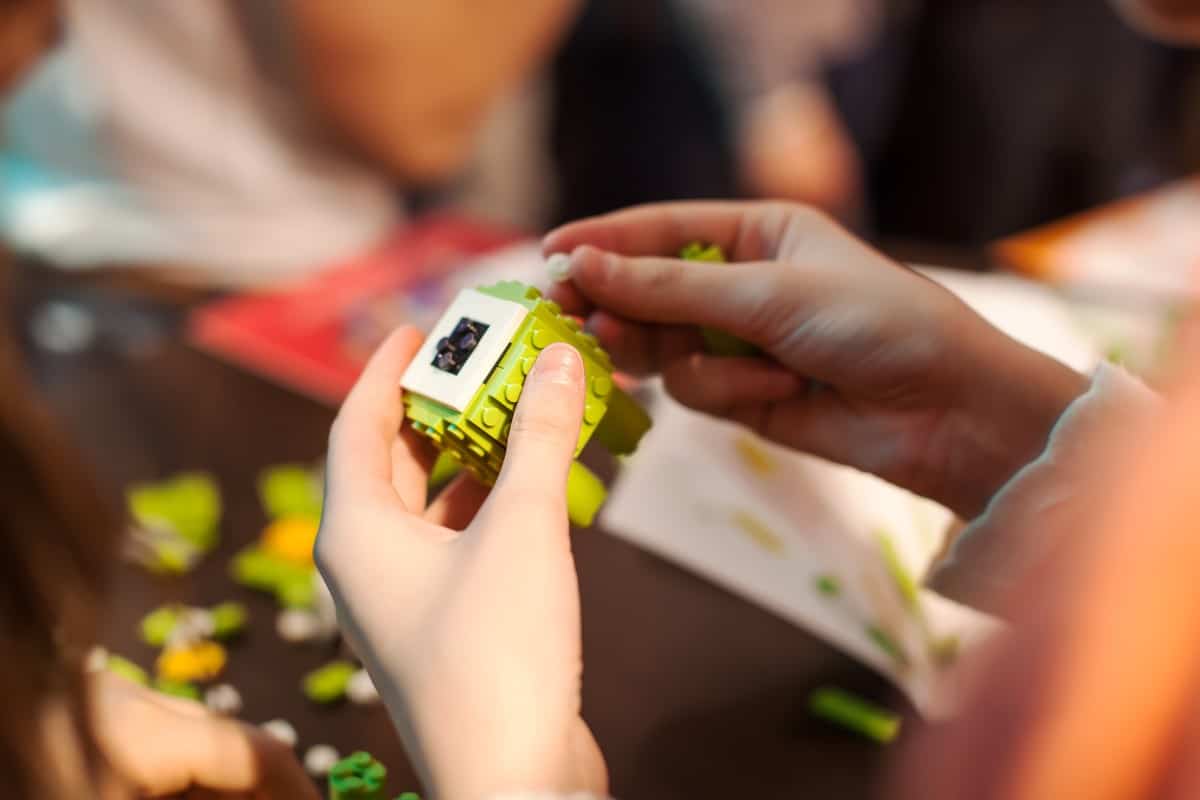 Girl playing Lego.